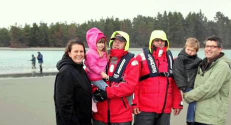 Photo caption: Peter Deefholts (far right) was rescued by Coastguard Waimakariri-Ashley volunteers after being washed out to sea while he was fishing at the Waimakariri-Ashley river mouth in January 2010. Peter is pictured with his family, Coastguard Unit President Dave Johnson (left) and Coastguard volunteer Noel Pope. 